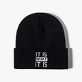 Black knit beanie with IT IS WHAT IT IS white embroidery for winter casual wear - One Size / Black