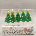 Five green Christmas tree birthday candles with stars in a transparent party pack - Green Christmas Tree Candle