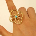 Detail of a large gold hollow flower ring with a turquoise stone and rope texture - Turquoise Hollow Flower (DZ-915)