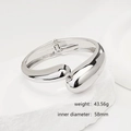 Close-up of minimalist silver irregular open bangle on a white textured stone base - Minimalist Shiny Silver Chunky Cuff (SL240) / Silver