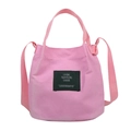 Pink canvas bucket bag with handles and adjustable shoulder strap for daily use - Pink