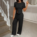 Completo estivo nero da donna con maglia a maniche corte e pantaloni larghi a gamba - S / Nero