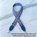 Detail of adjustable blue jacquard strap with white arrow pattern and gold hooks - Lake Blue with White Arrow - Lake Blue Leather