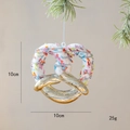 Christmas pretzel ornament with white frosting and golden finish, 10cm holiday decor - Donut