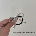 Silver metallic bow hair tie with crinkled texture measuring 6.0cm by 4.5cm - Bowknot Silver