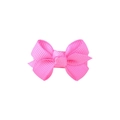 Detail of bright pink grosgrain ribbon bow hair clip with textured fabric surface - Peach Pink