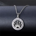 Macro shot of silver stainless steel pendant with crown design and sparkling stones - NZ12 Crown Hollow