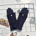 Winter dark blue knitted gloves with floral wrist decor on a white grid and magazine - Dark Blue
