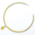 Macro shot of yellow heart-shaped zircon necklace with silver-tone metal settings - Silver Yellow Zirconia Necklace