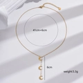 Gold stainless steel crescent moon pendant necklace with adjustable chain and three charms - Gold