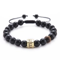 Detail of beaded bracelet with black onyx, tiger eye stone and gold zircon letter E charm - Letter E-Black Agate Bracelet