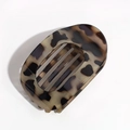 Close-up of a stylish leopard print flat hair claw with smooth glossy finish and hollow detail - Khaki Leopard Print