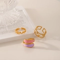 Set of gold titanium rings featuring Love script, star elements, and pink enamel details - J630-Love Star Enamel 3-Piece Set