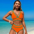 Two-piece bright orange bikini with contrast green trim and deep V-neck sport cut - Orange