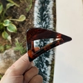 Detail of 8cm amber tortoise shell hair claw clip featuring a triangular hollow design - 8cm / Glossy Red Brown