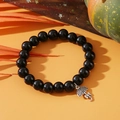 Black beaded single-layer bracelet featuring a silver umbrella charm on orange background - Halloween Umbrella Charm Black