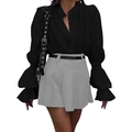 Detailed view of long lantern sleeves on black shirt paired with pleated grey mini skirt - S / Black