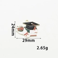 Enamel graduation cap and diploma charm pendant in black and red alloy with gold trim - Flower Graduation Cap