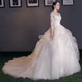 Elegant white lace long sleeve wedding gown with layered organza cathedral train - US 2 / White With Train