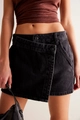 Detail of high-waisted black denim shorts with asymmetrical button closure for women - S / Black