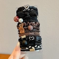 Brown and black elastic hair ties set with heart charms in a clear storage box - Pearl Black