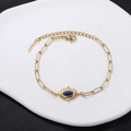 Vintage gold paperclip chain bracelet with oval turquoise stone and lobster clasp - Deep Blue Stone