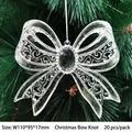 Silver Christmas bow ornament with hollow pattern and black gem on a green tree - Christmas Bow 110mm (20Pcs/Pack)