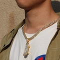 Close-up of a gold-plated Cuban chain with a crystal-encrusted scooter pendant on a model - Gold 9mm*20inch Cuban Link Chain