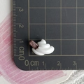 Macro shot of miniature cream dessert charm with Happy sign, size reference 2cm x 1.5cm - Mini Chocolate Cream