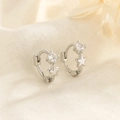 Boucles d'oreilles huggie exquises en argent 925 avec breloque étoile en zircone - Argenté