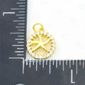 Golden starfish pendant with cubic zirconia inlay showing size on measurement scale - Starfish