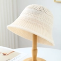 Beige hollow knit bucket hat for women with breathable crochet texture on a wooden stand - M(56-58cm) / Hollow Knit Style (5639) / White