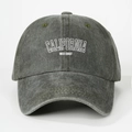 Detailed close-up of CALIFORNIA WEST COAST white embroidery on a washed grey baseball cap - One Size / Army Green