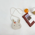 Detail view of cream white PU leather bunny cross-body bag with orange flower decor - Round Off-white