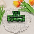Green acrylic four-leaf clover hair claw clip displayed on glass with tulips background - Square Four-leaf Clover 8.5*5*4cm