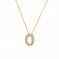 Detailed close-up of a gold O-letter pendant with micro-paved sparkling zircon stones - Letter O