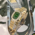 Detail of elegant green oval dial watch with luxury crystal-encrusted gold bracelet - Gold Color Green