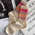 Creamy white crew socks with colorful striped ribbed cuffs on a fashion magazine - One Size / Off-white Pure Cotton