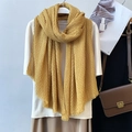 Ginger yellow pleated linen scarf hanging on a mannequin for an elegant minimalist look - Ginger Yellow