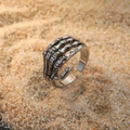Vintage punk skeleton hand open adjustable ring in retro silver metal finish on sand - Adjustable Open / Silver