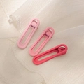Dettaglio di tre fermagli per capelli rosa opaco in varie tonalità per lo styling - D-001 Set di 3 Pezzi Rosa per Ragazza