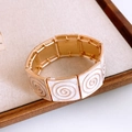 Detail of vintage gold-plated square bracelet with white enamel spiral texture - Gold-Beige