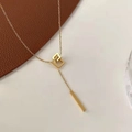 Minimalist golden geometric necklace featuring nested squares and a sleek metal bar pendant - Gold Geometric