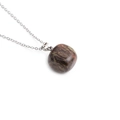 Minimalist silver chain necklace featuring a polished round tiger eye stone pendant - Brown Textured Stone