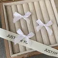 Three white satin ribbon bow hair clips set in a wooden jewelry box for DIY crafts - Pure White