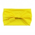 Elastic cotton yoga headband in vibrant yellow color with a decorative bow knot detail - Bright Yellow