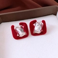 Macro shot of red flocked square earrings with large rectangular crystal stones - Silver Earring Post - Red