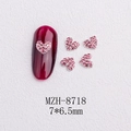 Macro shot of 3D pink heart-shaped nail art charms with micro-pave rhinestones - Silver Heart Pink Rhinestone Style(8718)