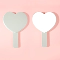 Beige heart shaped hand mirror with ergonomic plastic handle and glass reflective surface - Light Gray
