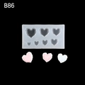 DIY heart shaped silicone mold B86 with pink and blue wax heart samples on black background - B86